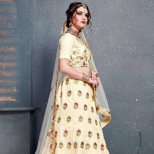 Magnetic Cream Colored Wedding Wear Embroidered Silk Lehenga Choli