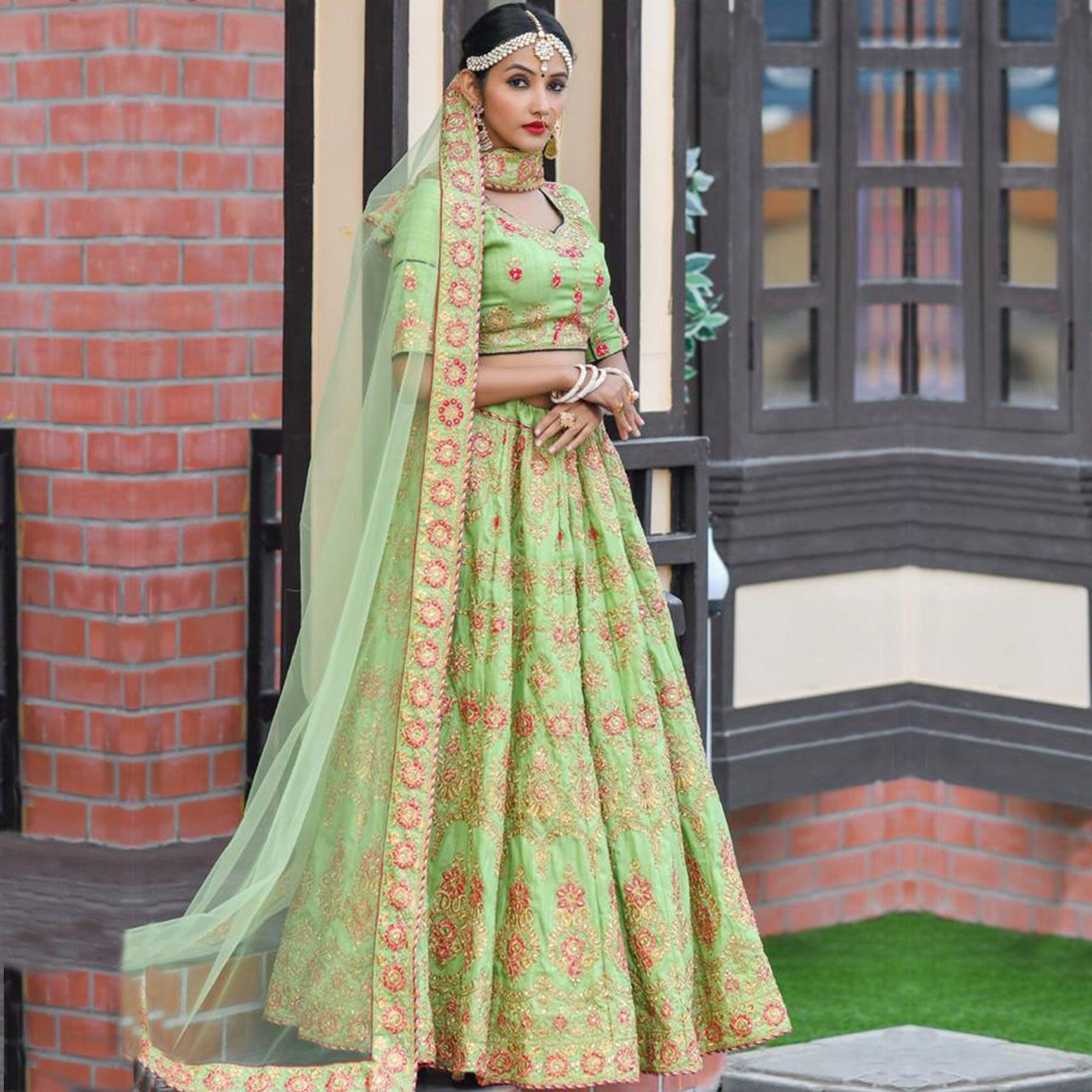 Magnetic Green Colored Party Wear Embroidered Silk Lehenga Choli