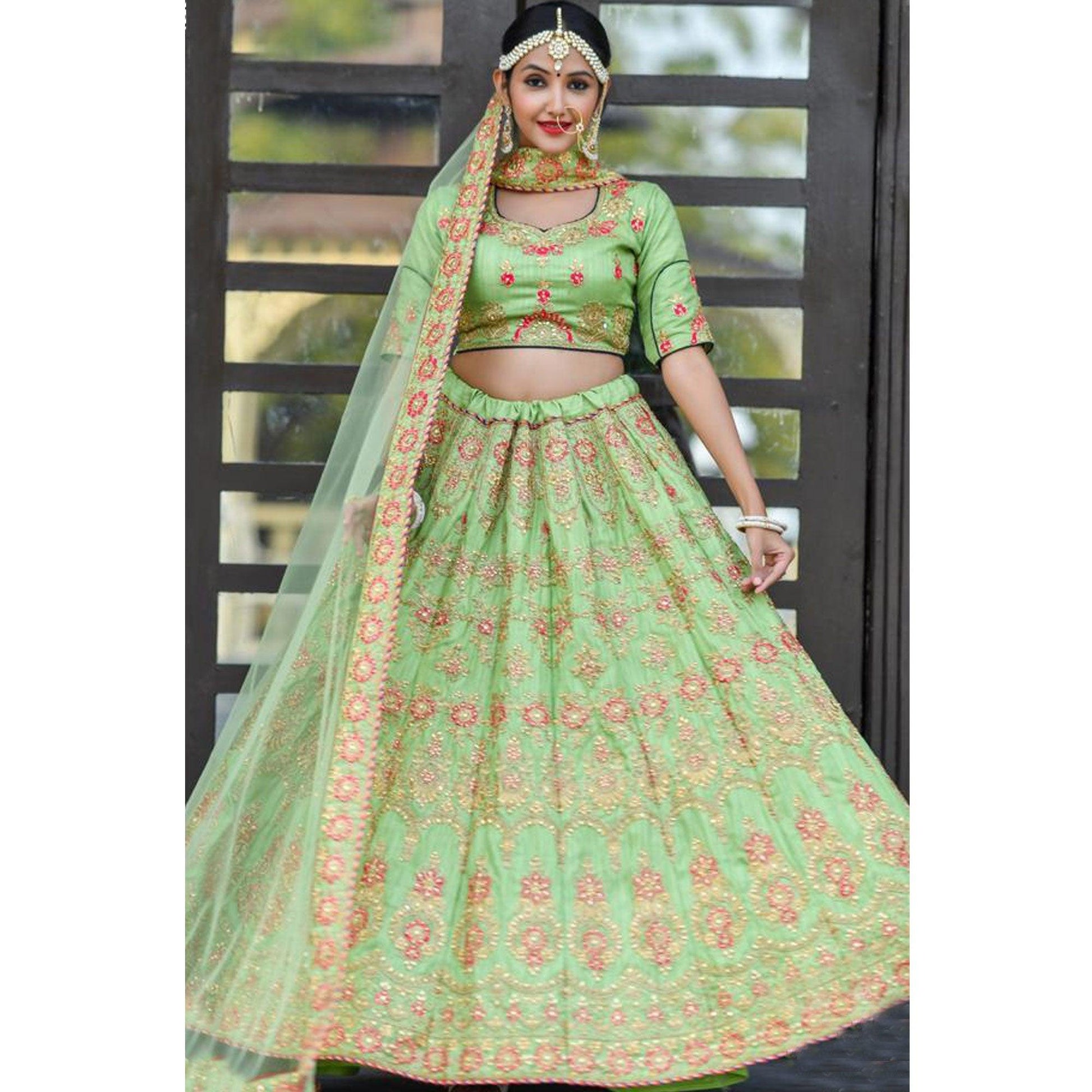 Magnetic Green Colored Party Wear Embroidered Silk Lehenga Choli