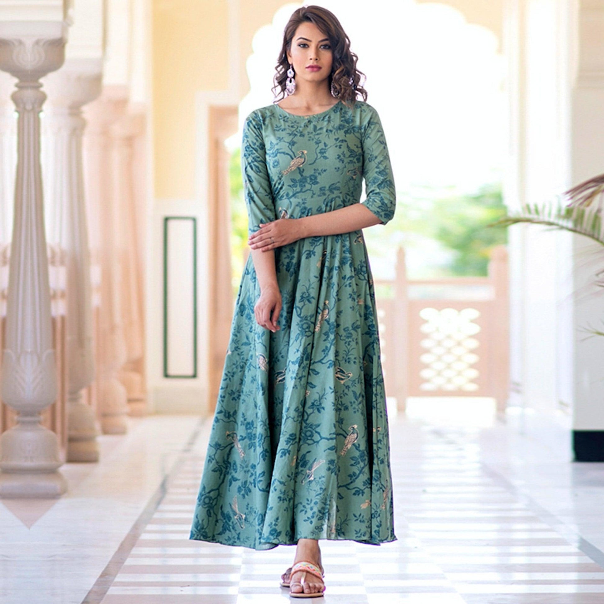 Magnetic Light Aqua Colored Partywear Printed Muslin Blend Long Kurti