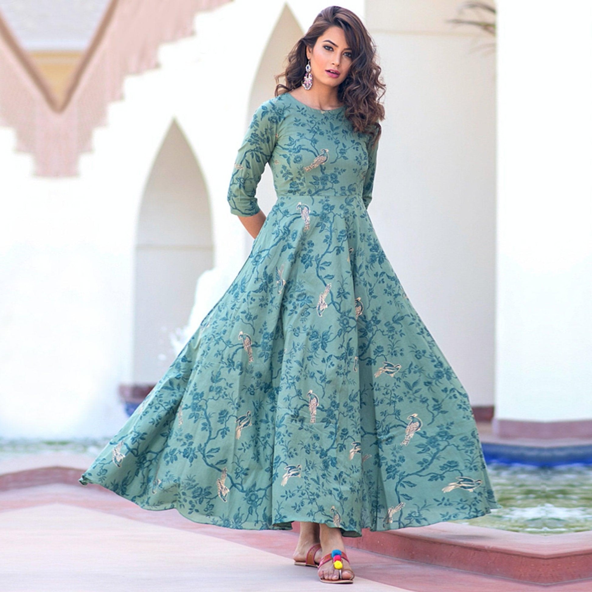 Magnetic Light Aqua Colored Partywear Printed Muslin Blend Long Kurti