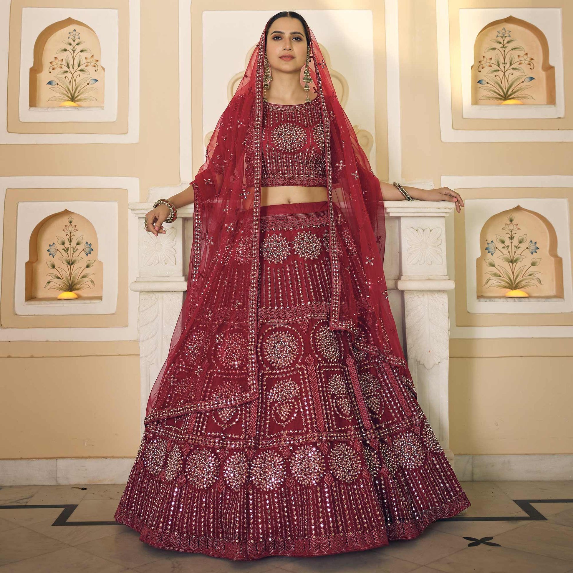 Maroon Wedding Wear Embellished Netted Lehenga Choli