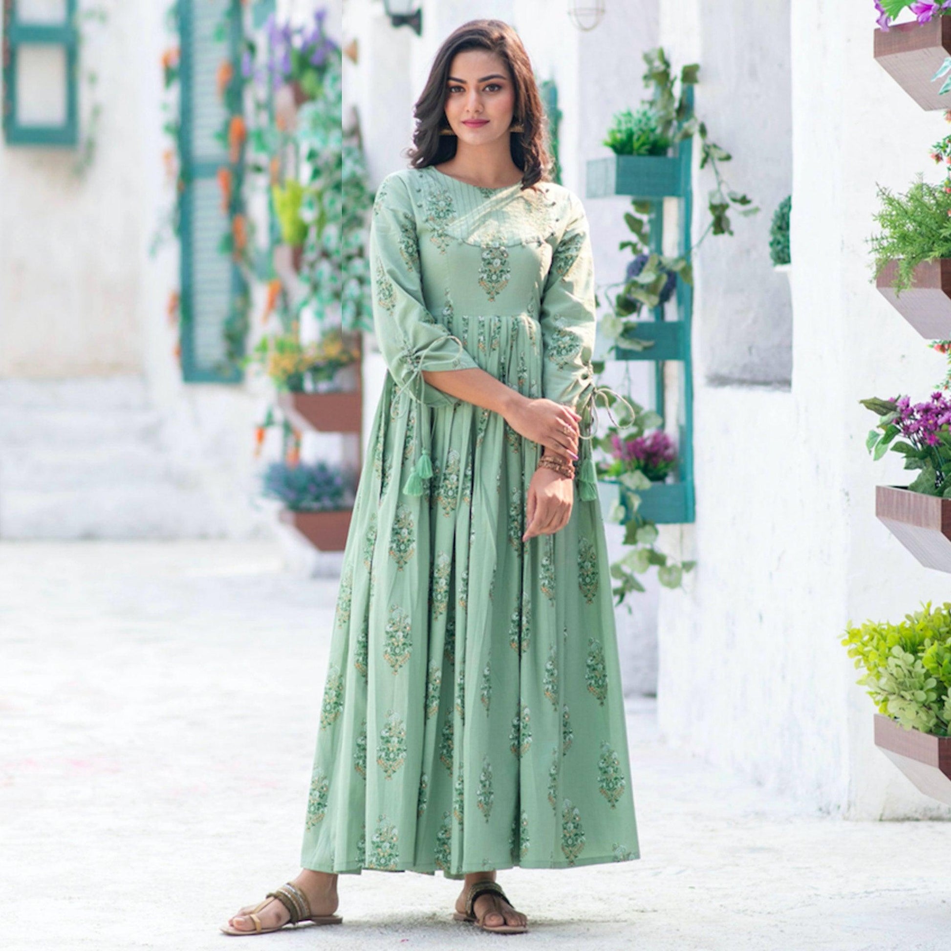 Marvellous Moss Green Colored Partywear Digital Printed Pure Muslin Gown