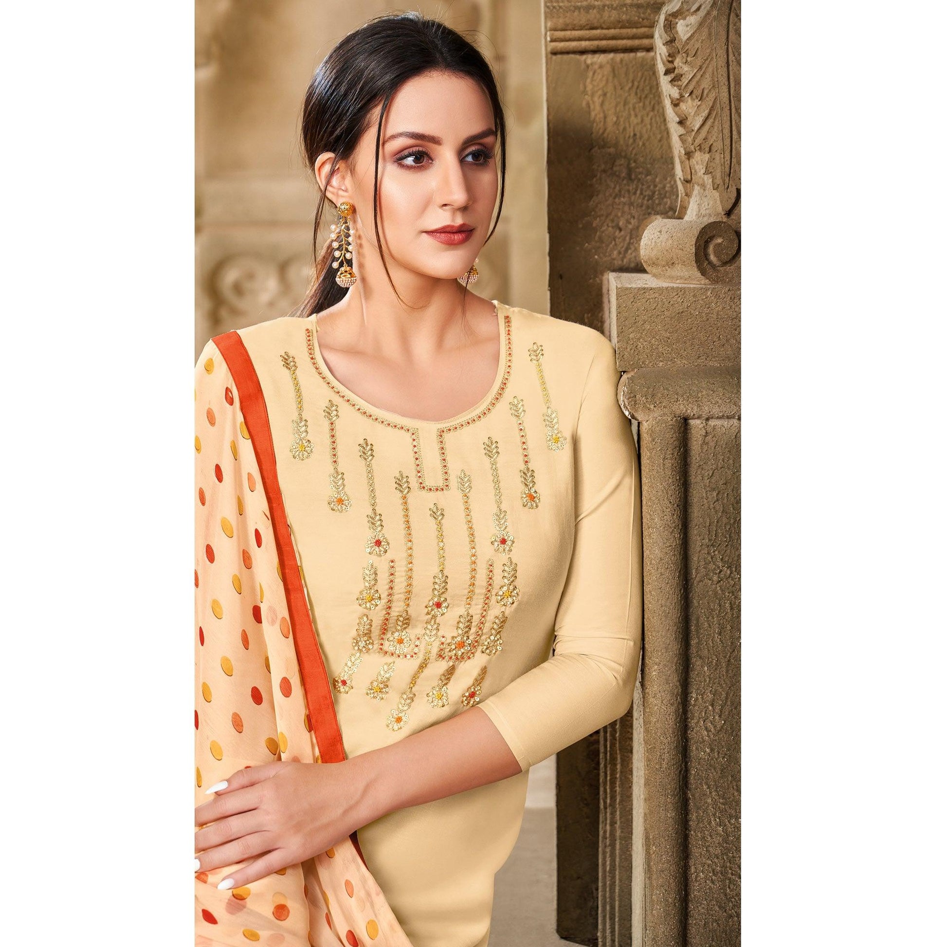 Mesmeric Cream Colored Casual Wear Embroidered Chanderi Dress Material