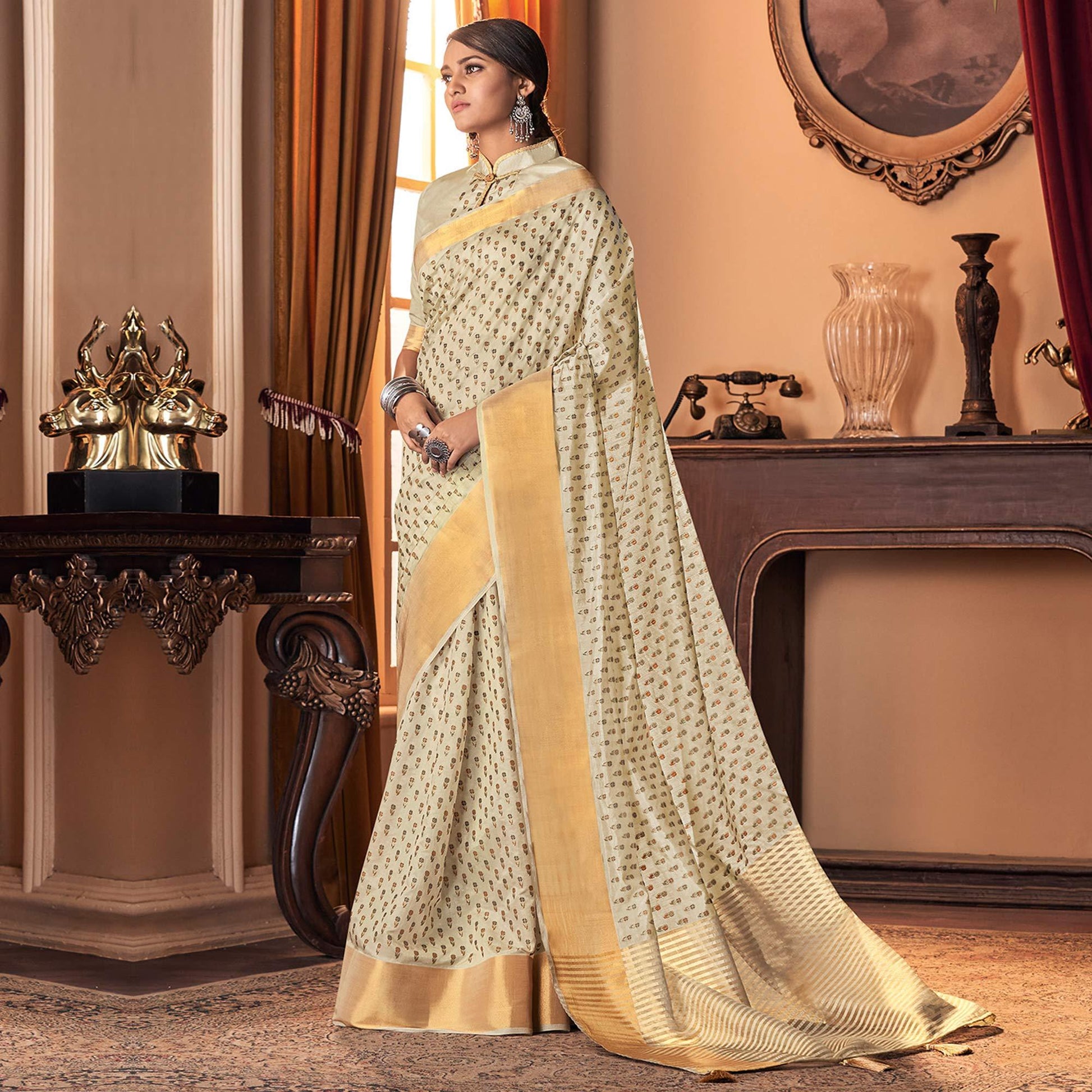 Mesmerising Cream Colored Festive Wear Printed And Woven Border Silk Saree