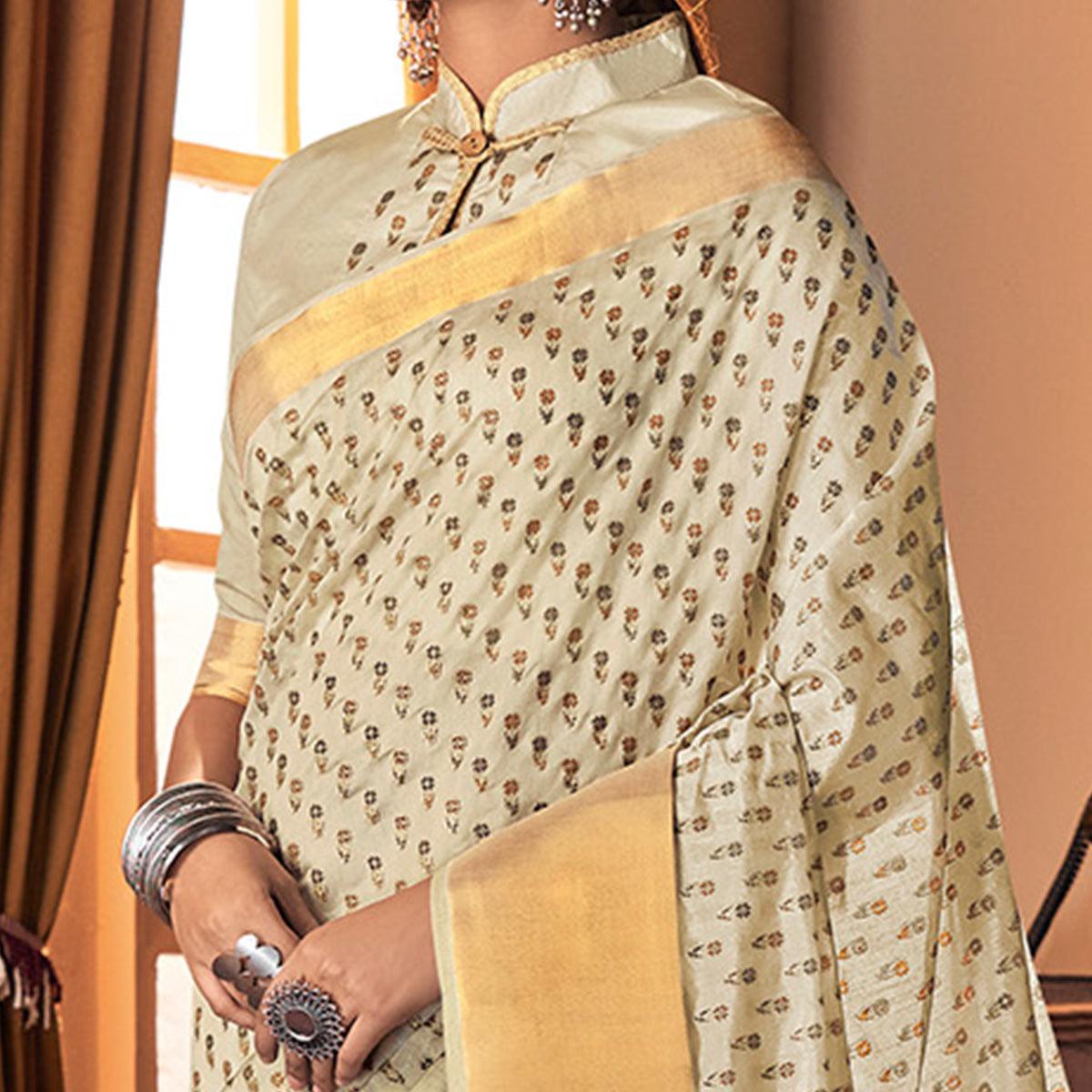 Mesmerising Cream Colored Festive Wear Printed And Woven Border Silk Saree