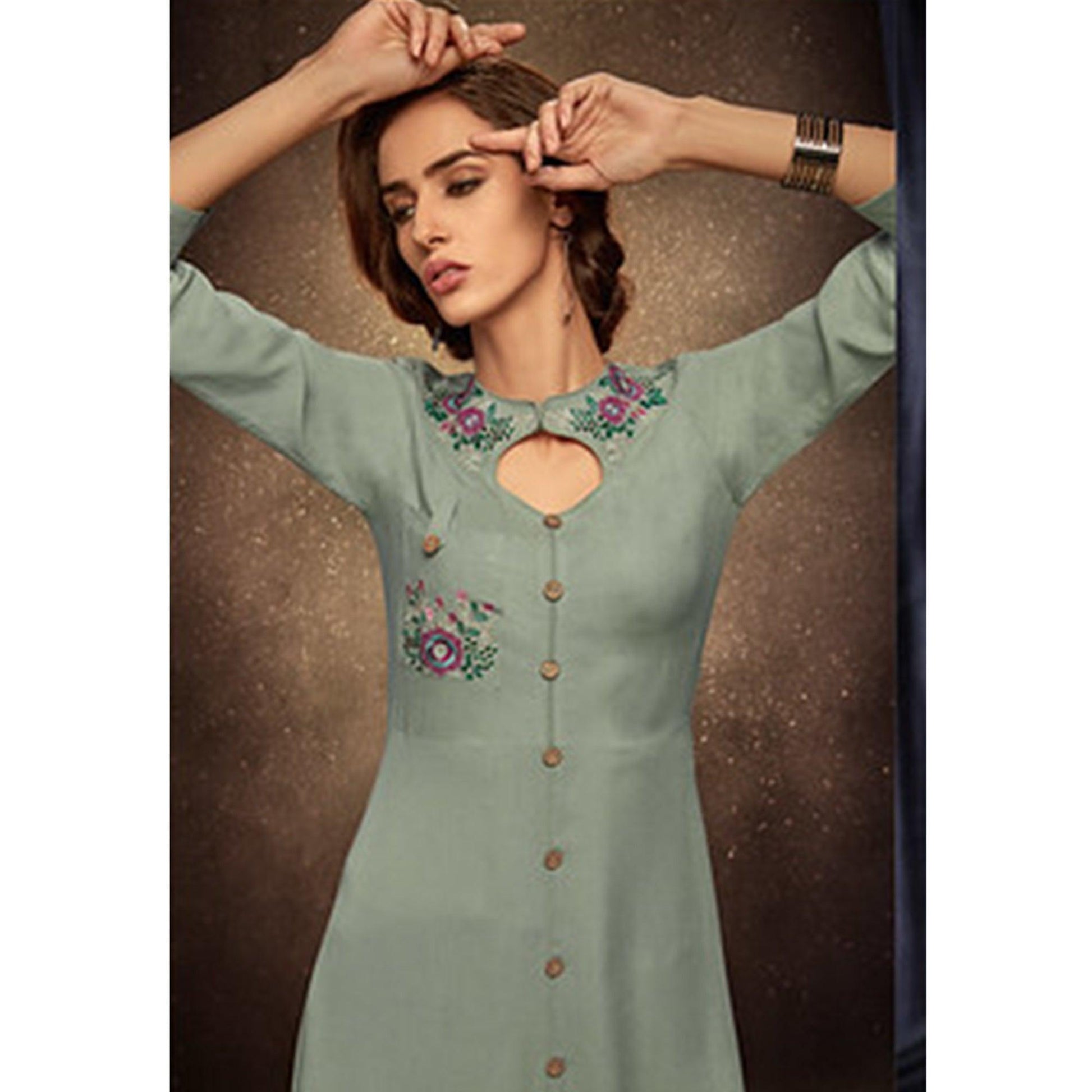 Mesmerising Light Pastel Green Colored Partywear Embroidered Rayon Long Kurti
