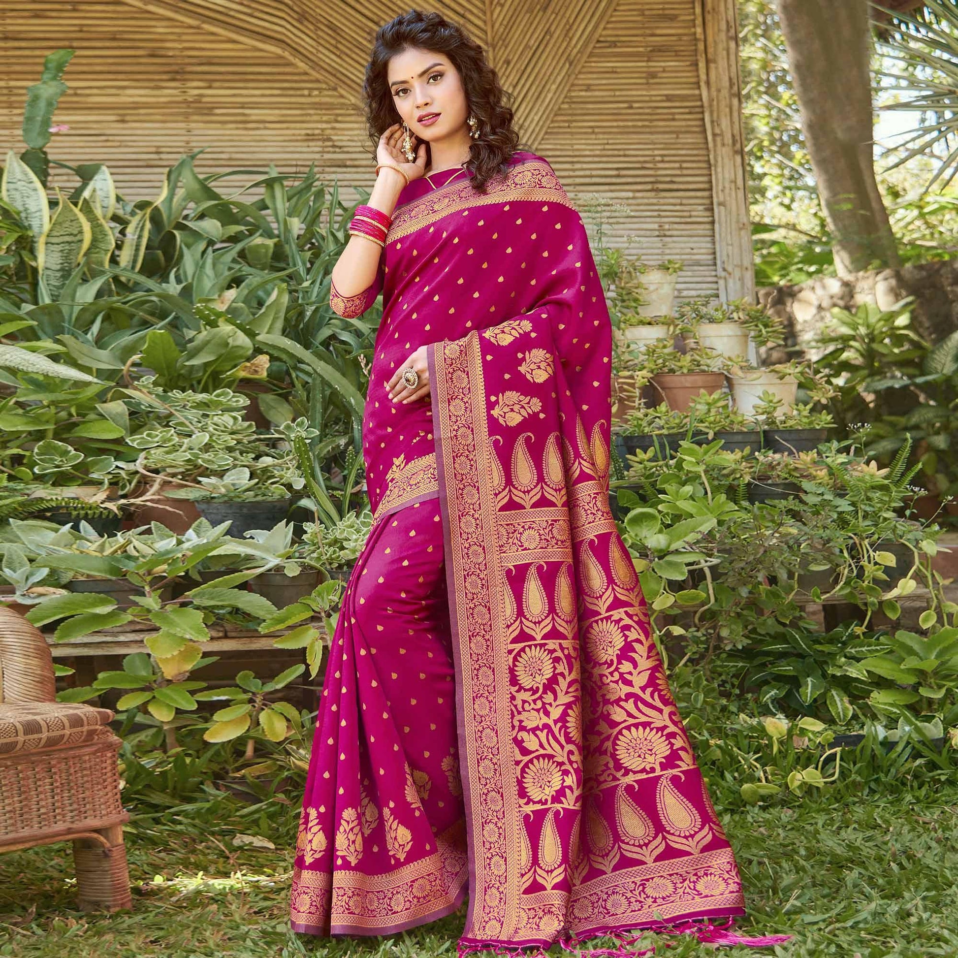 Mesmerising Magenta Pink Colored Festive Wear Floral Woven Silk Blend Saree With Tassels