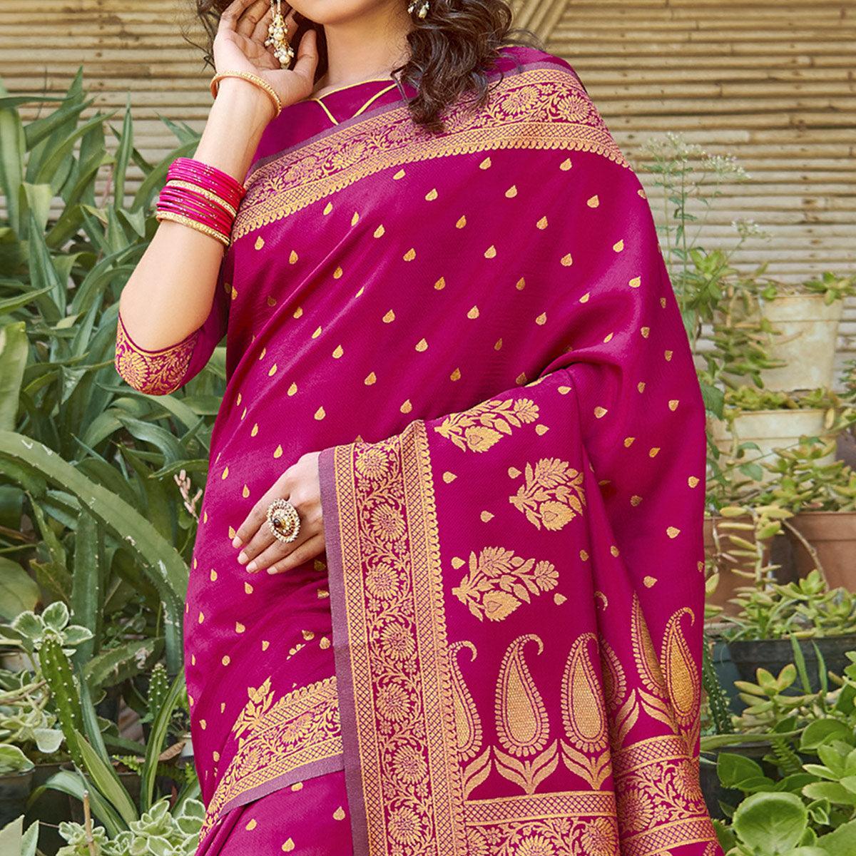Mesmerising Magenta Pink Colored Festive Wear Floral Woven Silk Blend Saree With Tassels