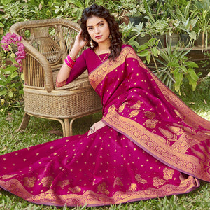 Mesmerising Magenta Pink Colored Festive Wear Floral Woven Silk Blend Saree With Tassels