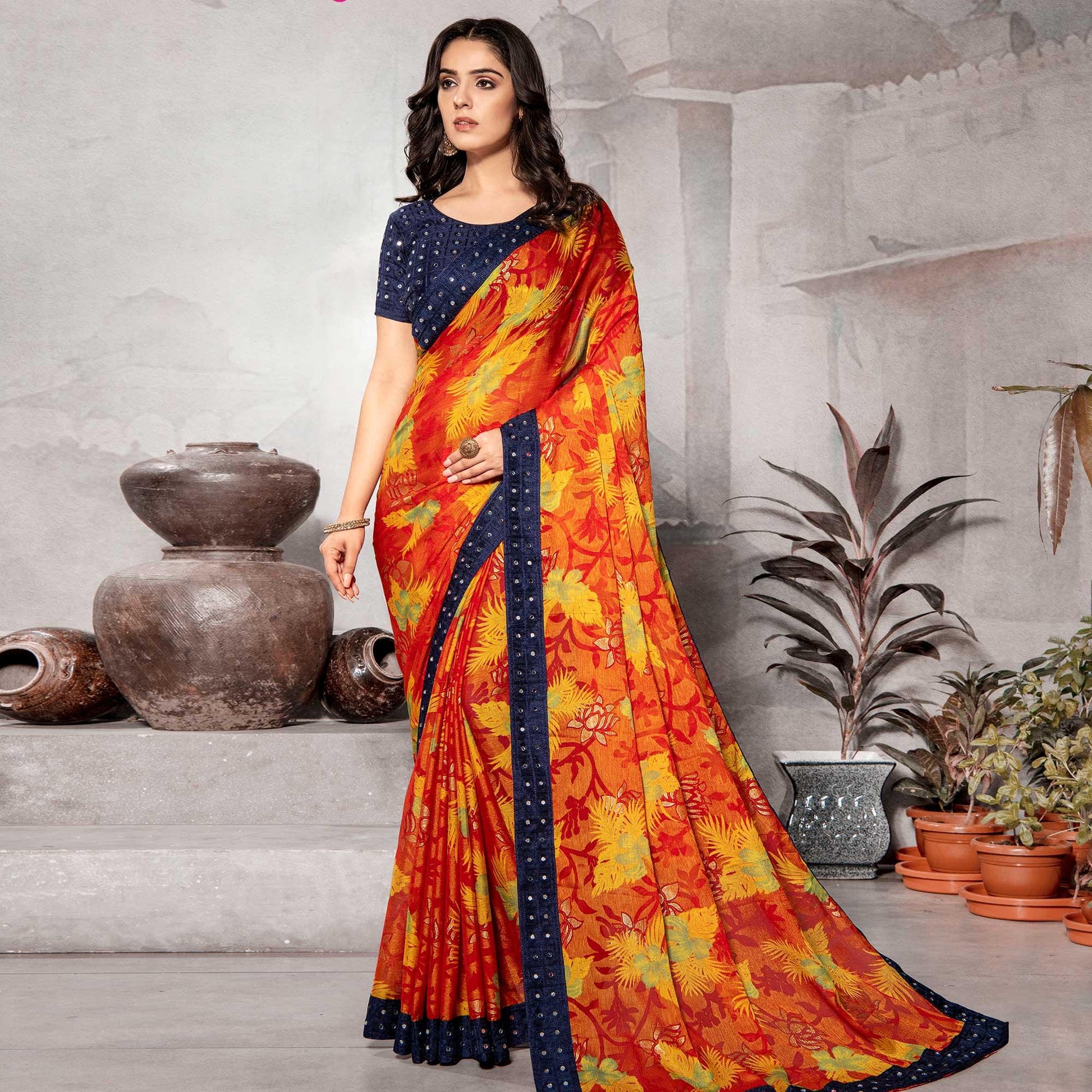 Mesmerising Orange Colored Partywear Embroidered Chiffon Brasso Saree