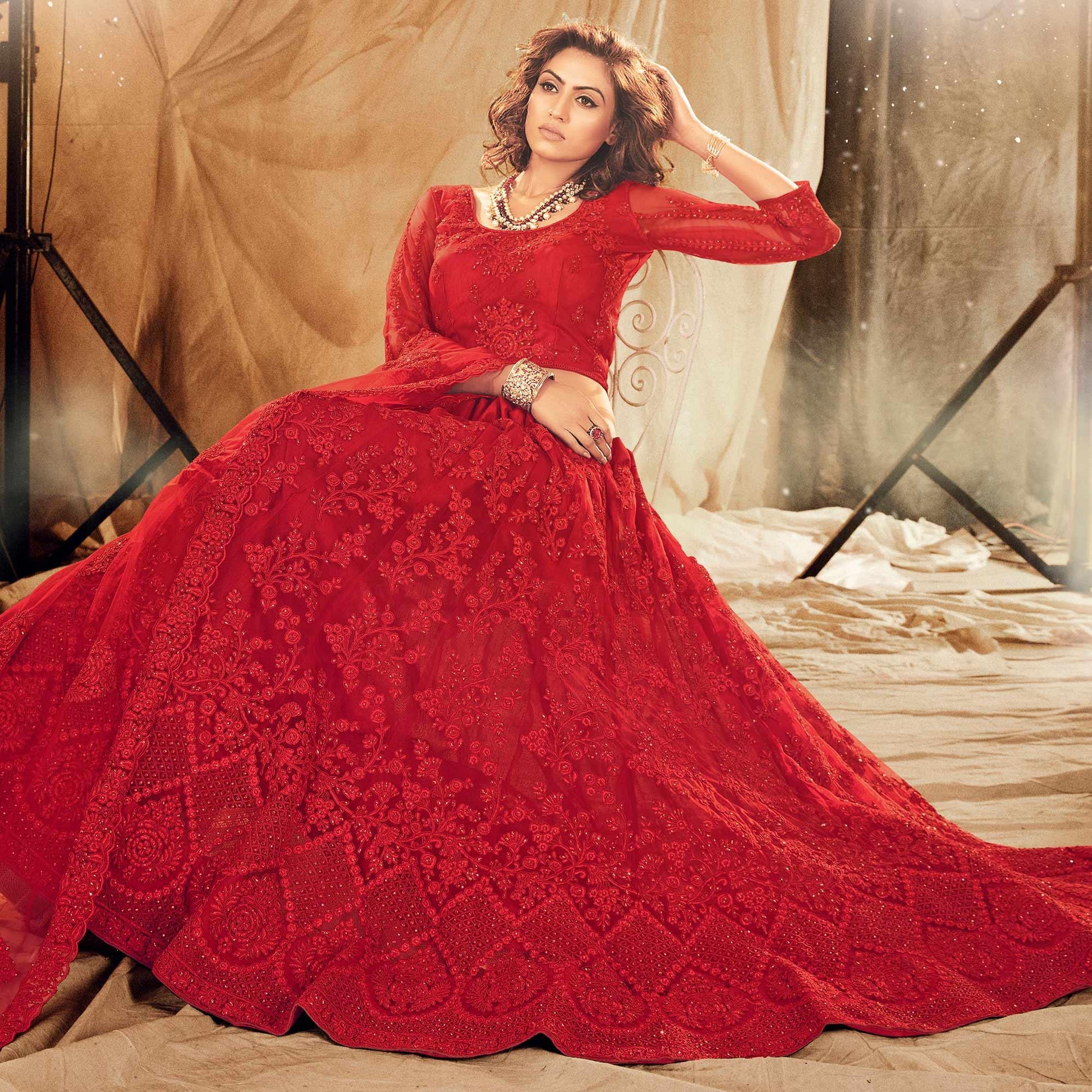 Mesmerising Red Colored Wedding Wear Embroidered Net Lehenga Choli