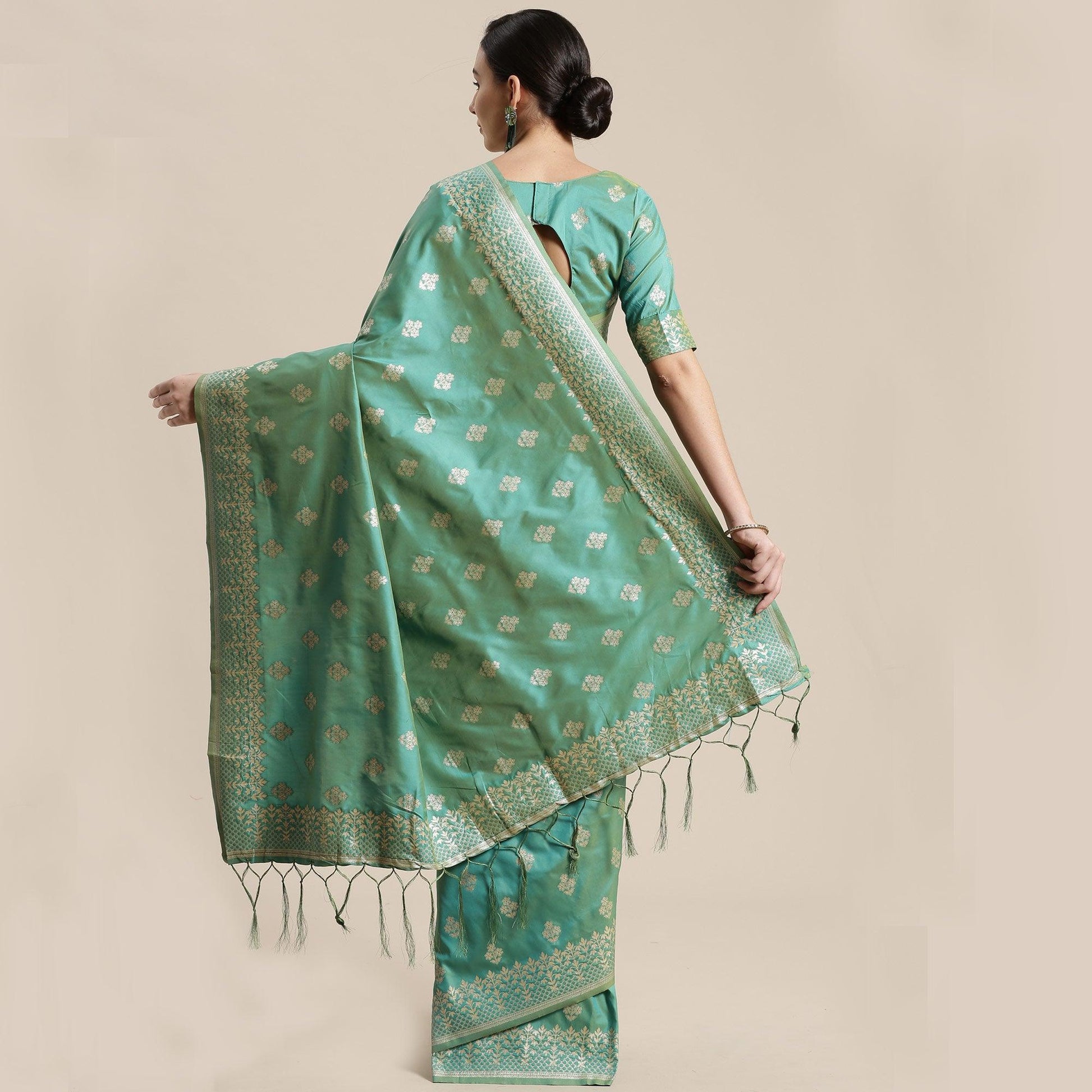 Mesmerising Sea Green Colored Festive Wear Silk Blend Woven Floral Saree With Tassels