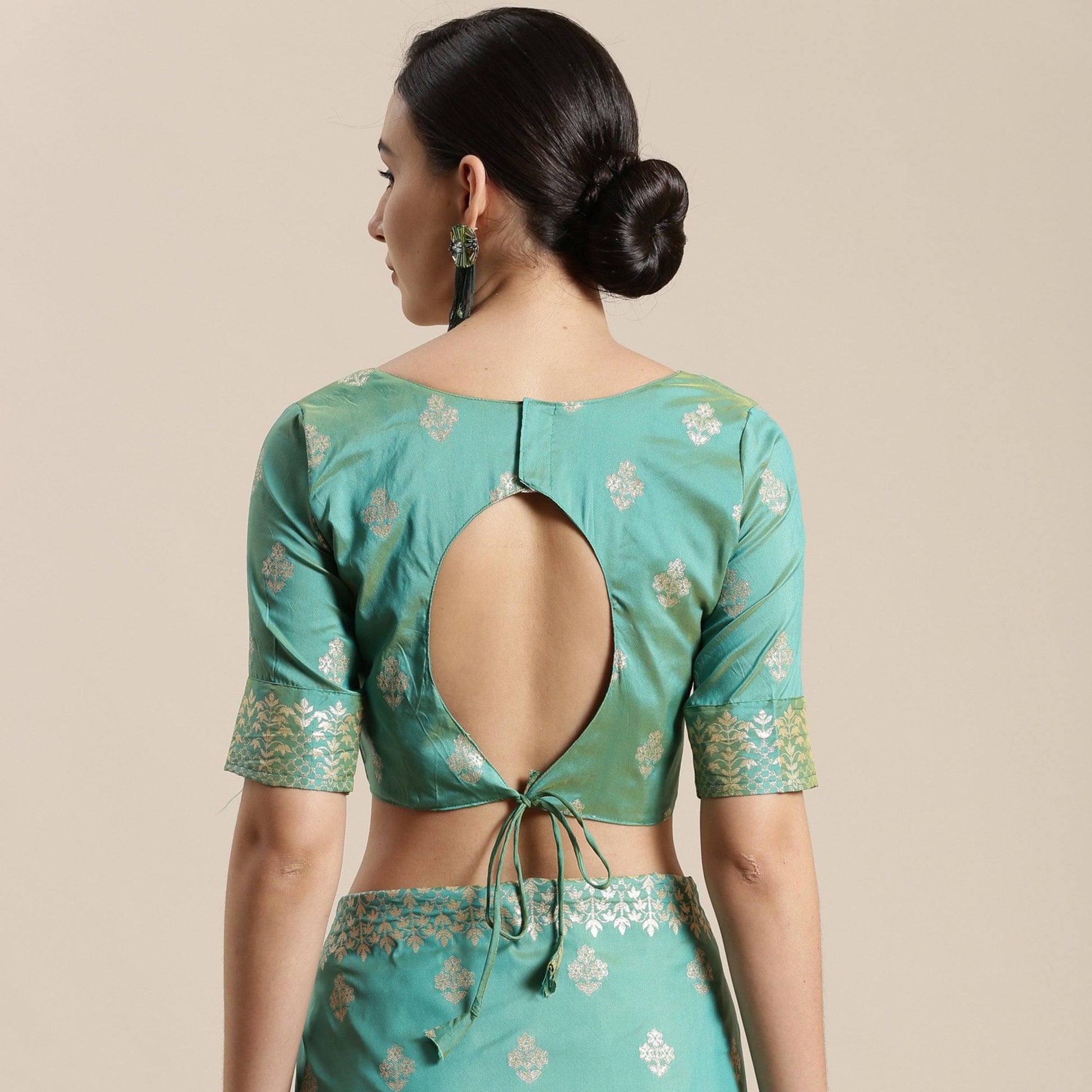 Mesmerising Sea Green Colored Festive Wear Silk Blend Woven Floral Saree With Tassels