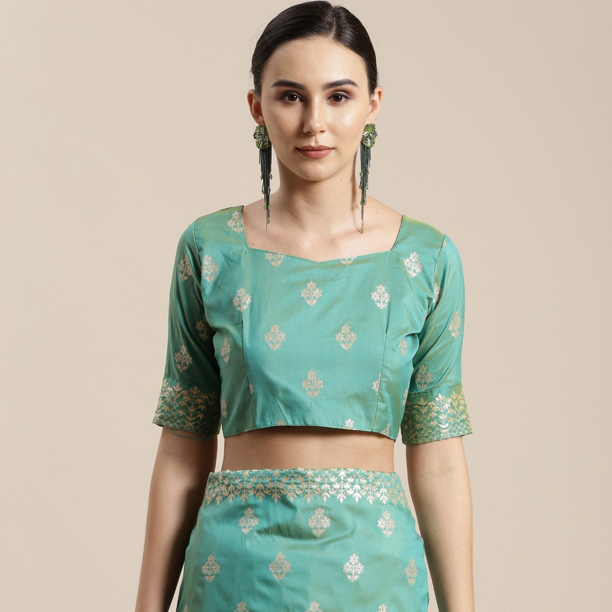 Mesmerising Sea Green Colored Festive Wear Silk Blend Woven Floral Saree With Tassels