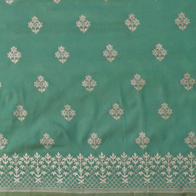 Mesmerising Sea Green Colored Festive Wear Silk Blend Woven Floral Saree With Tassels