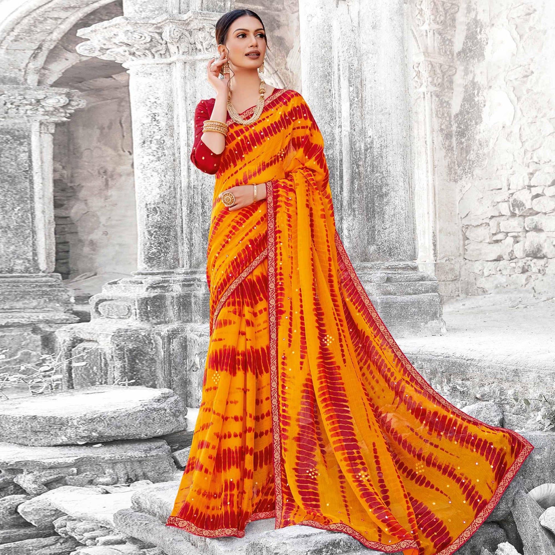 Mesmerising Yellow & Red Coloured Partywear Embellished Chiffon Saree