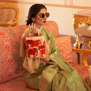 Mint Green Woven Linen Saree With Tassels