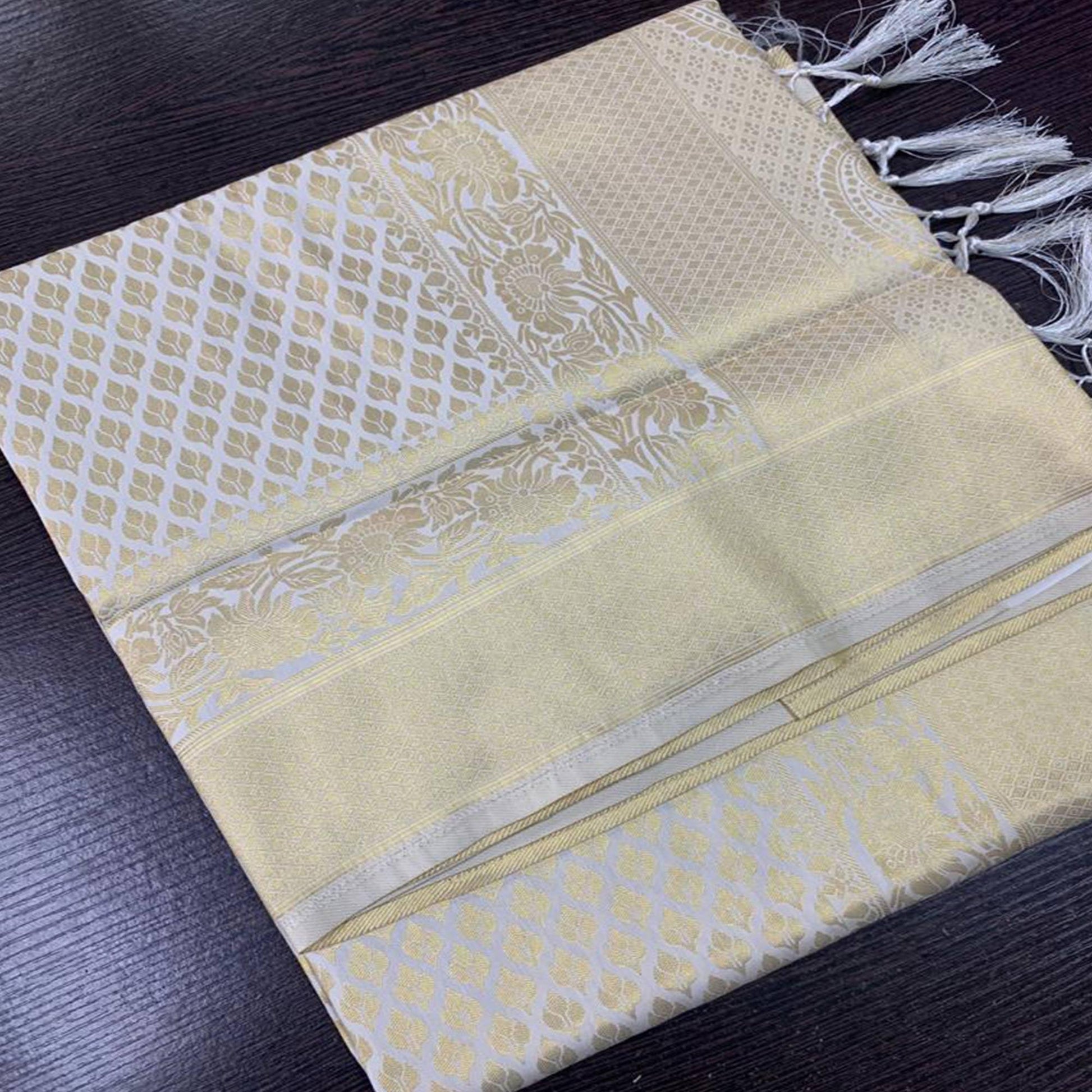 Cream Woven Art Silk Saree With Tassels